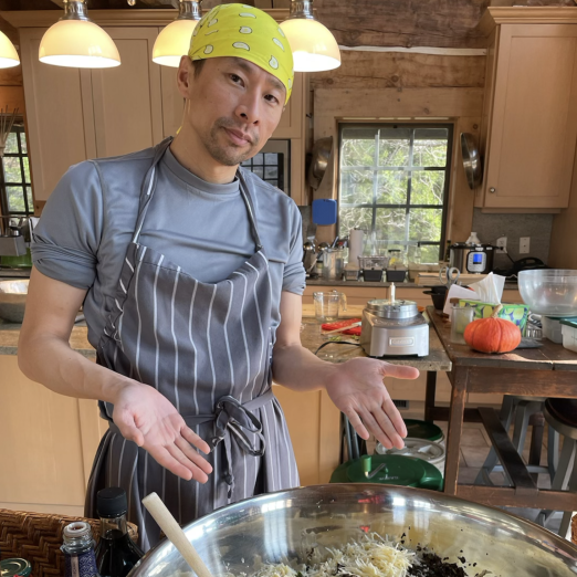 Weishin Huang in the Ancestral Heart Kitchen showing very large bowl of chopped food