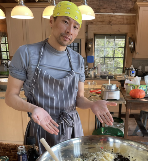 Weishin Huang in the Ancestral Heart Kitchen showing very large bowl of chopped food