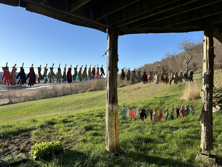 Gardening Gloves drying on a clothesline against the backdrop of the Taconic Mountains at Ancestral Heart Temple