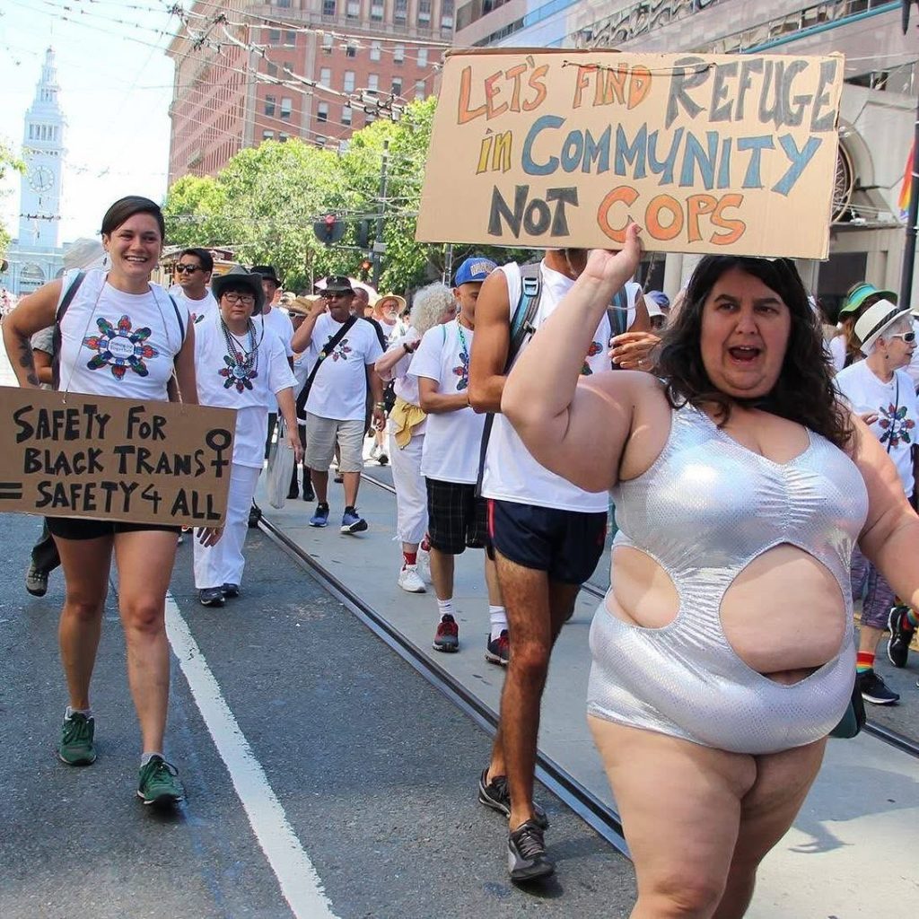 Dawn Haney marching in the 2016 SF Pride March with TWO EBMC dharma teachers being celebrated as Grand Marshalls -- Larry Yang and Lev Moses (known at the time as Fresh! Lev White), while also seeking justice from police violence